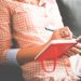 woman journaling e1544551335556