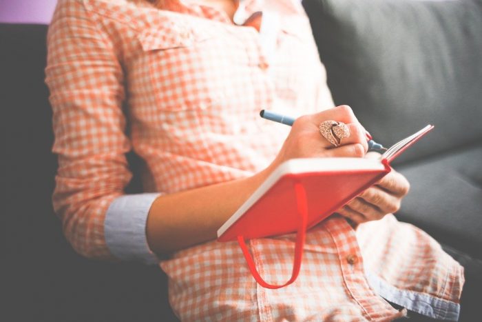 woman journaling e1544551335556