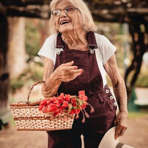 old woman with flower basket