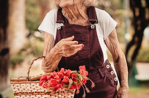 old woman with flower basket
