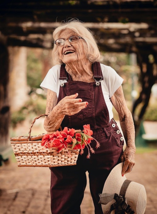 old woman with flower basket